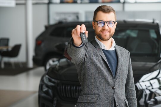 Man Adult Customer Male Buyer Client Wears Classic Suit White Shirt Chooses Auto Wants To Buy New Automobile Touch Check Car In Showroom Vehicle Salon Dealership Store Motor Show Indoor. Sales Concept