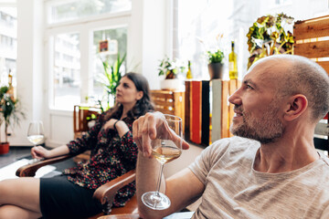 people relaxing in a cozy wine bar