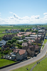 Fototapeta na wymiar Aerial views of Bamburgh village in Northumberland, UK, as seen from castle walls