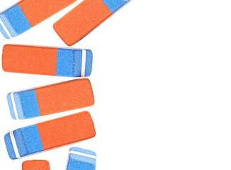 Classic pink and blue erasers isolated on a white background with copy space. Top view.