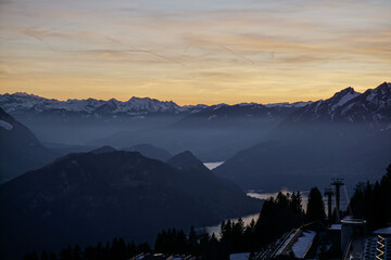 Orange sunset on alpine mountains and lake	