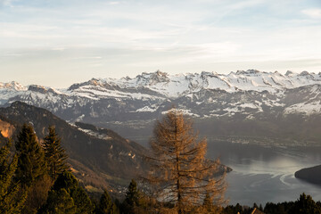 Lake in the mountains of Switzerland. Snow peaks