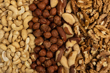 Different varieties of nuts background. Nuts close-up.