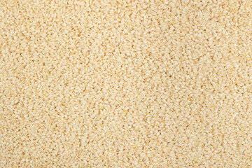 Sesame seeds background. White sesame texture.