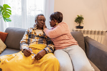 senior couple, sick man, his wife takes care of him - Powered by Adobe