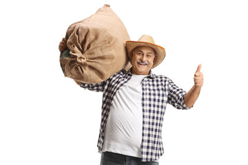 Farmer carrying a big burlap sack on his shoulder and gesturing thumbs up
