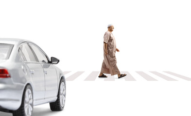 Vehicle and a mature arab man in ethinc clothes walking on a pedestrian crossing