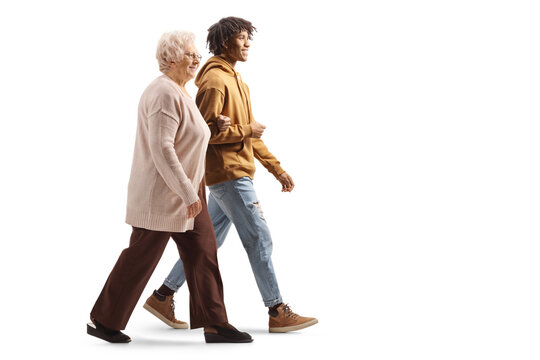 Young african american man holding an elderly woman under arm and walking