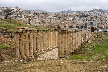 Fototapeta na wymiar Jerash ruins of famous Roman City, Jordan, well preserved pillars and historic road