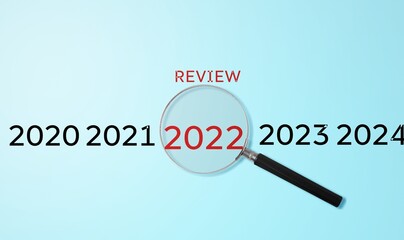 Magnifying glass with 2022 numbers review