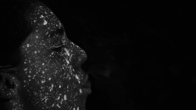 Portrait of Beautiful Fashion Woman in Neon UF Light. Model Girl with Fluorescent Creative Psychedelic MakeUp, Art Design of Female Disco Dancer Model in UV, Colorful Abstract Make-Up.