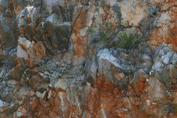A safety net covering cliffs. Protection against falling rocks.