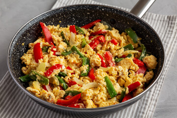 Homemade Scrambled Peppers and Eggs in a Pan, low angle view.