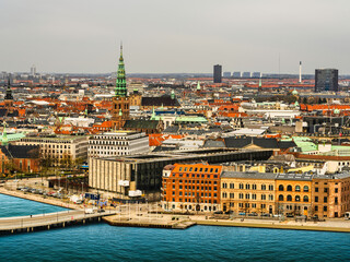 Obraz premium Aerial shot of downtown Copenhagen's historic buildings and Christiansborg Palace tower, Denmark