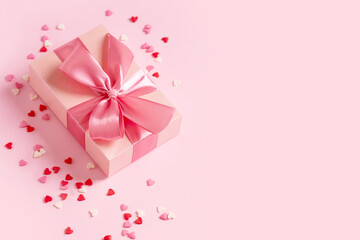 Candy pink confetti with gift box on pink background