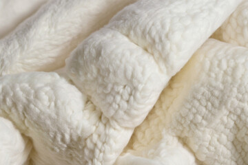 Closeup of a soft white material, woolen texture, fluffy and cozy, winter mood, Creamy Knitted Texture