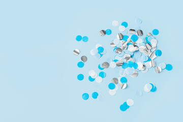 Confetti paper blue white and sparkle on blue background