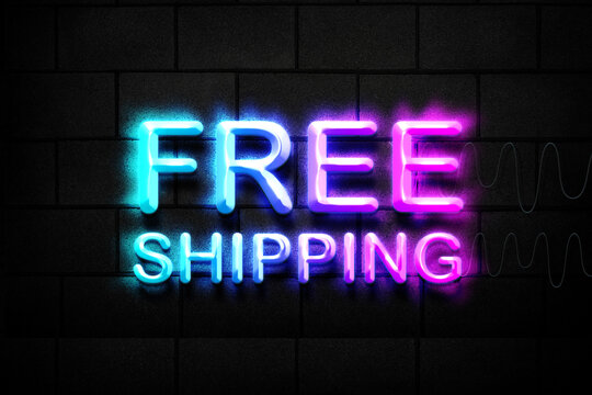 Free shipping neon sign on brick wall background