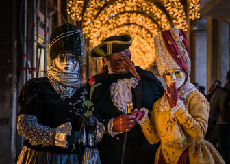 Obraz premium People wearing colorful and elaborate costumes during the Venice carnival in Italy 