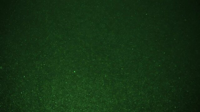 Fine green dust particles behave like snow during a blizzard