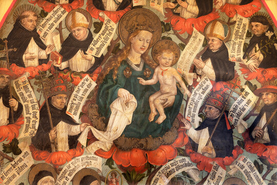 BERN, SWITZERLAND - JUNY 27, 2022: The detail of fresco of Madonna among the Dominican sanits in the church Franzosichche Kirche by anonym Nelkenmeister (1495-1500).