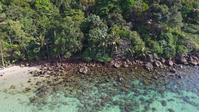 Secret snorkeling bay in a turquoise lagoon. Stunning aerial view flight drone