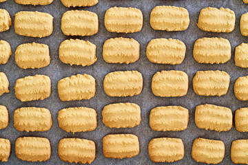 Traditional Christmas cookies on parchment paper, top view