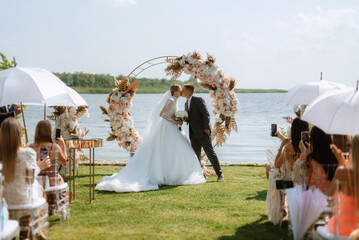 wedding ceremony of the newlyweds on the pier