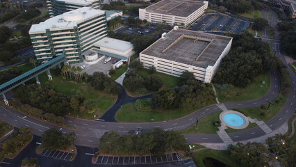 Ariel View sunset, sunset over empty parking lot,  
with random cars road