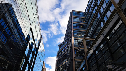 Naklejka premium High-rise buildings on blue sky background,streets of big city