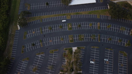 Ariel View sunset, sunset over empty parking lot,  
with random cars road