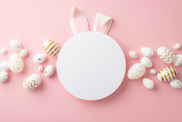 Easter decor concept. Top view photo of easter bunny ears on white circle white and golden eggs on isolated pastel pink background with copyspace