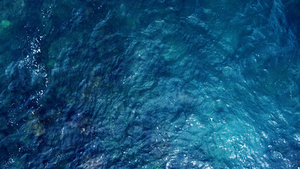 Obraz premium Blue water texture. Top view of the ocean surface with waves