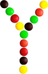 Multicolored candy spelling out the letter 