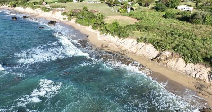 Sea level changes and coastal erosion issues - drone inspection of eroding cliff edge in the Caribbean - 