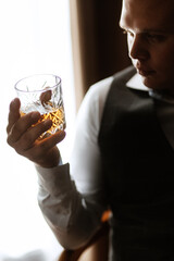 portrait of the groom of a man in the morning before the wedding