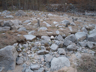 The dry bottom of the Ceresole Reale lake in autumn. Alps, Italy.