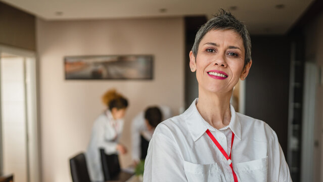 Woman Businesswoman Senior Caucasian Female Manager Or Entrepreneur Prepare For Conference Or Meeting In Hotel Room While Taking A Brake Standing Confident Official Real People Copy Space