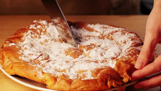 Ensaimada pie close up, a Spanish pastry typical of Mallorca, Majorca, Spain. Traditional dessert. 