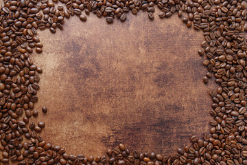 Coffee beans on wooden old background