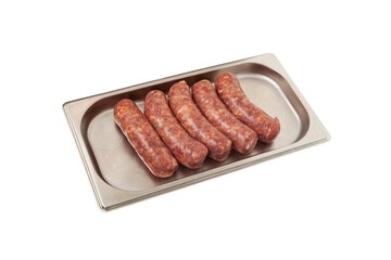 Raw barbecue sausages products on metal tray. Frankfurters. Natural meat processed foods on white background. Selective focus, copy space