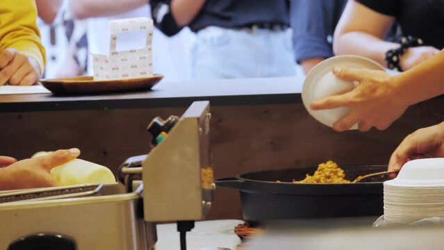 Traditional Italian risotto on street food market, festival in barcelona