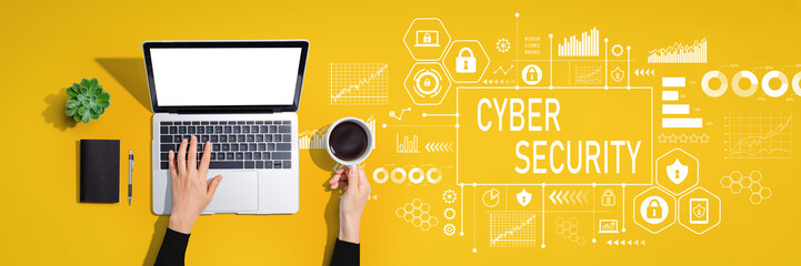 Cyber security theme with person using a laptop computer