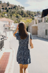 tourist girl walking down the street