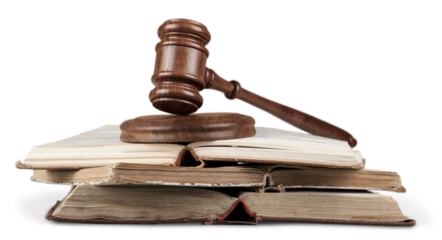 Wooden justice gavel on open books