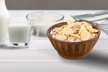 Oat flakes in the bowl. Tasty morning dish