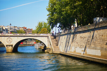 Fototapeta premium Scenic view of beautiful Seine river embankments from water in Paris