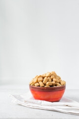 Nigerian Chin chin in an enamel bowl, Fried chin-chin snack in an enamel bowl, Nigerian party food and small chops