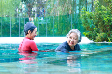 Asian woman or physiotherapist helping elderly female patient with hydrotherapy It is a...