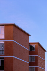 infonavit apartments made of brick during a sunset